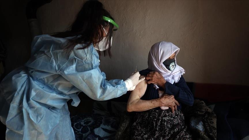 Health workers vaccinate 86-year-old woman living at altitude of 1,950 meters in central Turkey